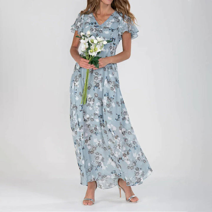 Blommig klänning - V-ringad med fjärilsärm - Maxi sommarklänning-Eva Jonsson