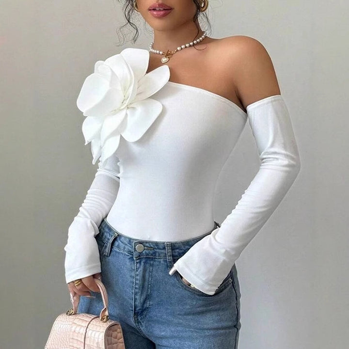 Dam Body med elegant Bloom-applikation och lång ärm Mirla-Eva Jonsson