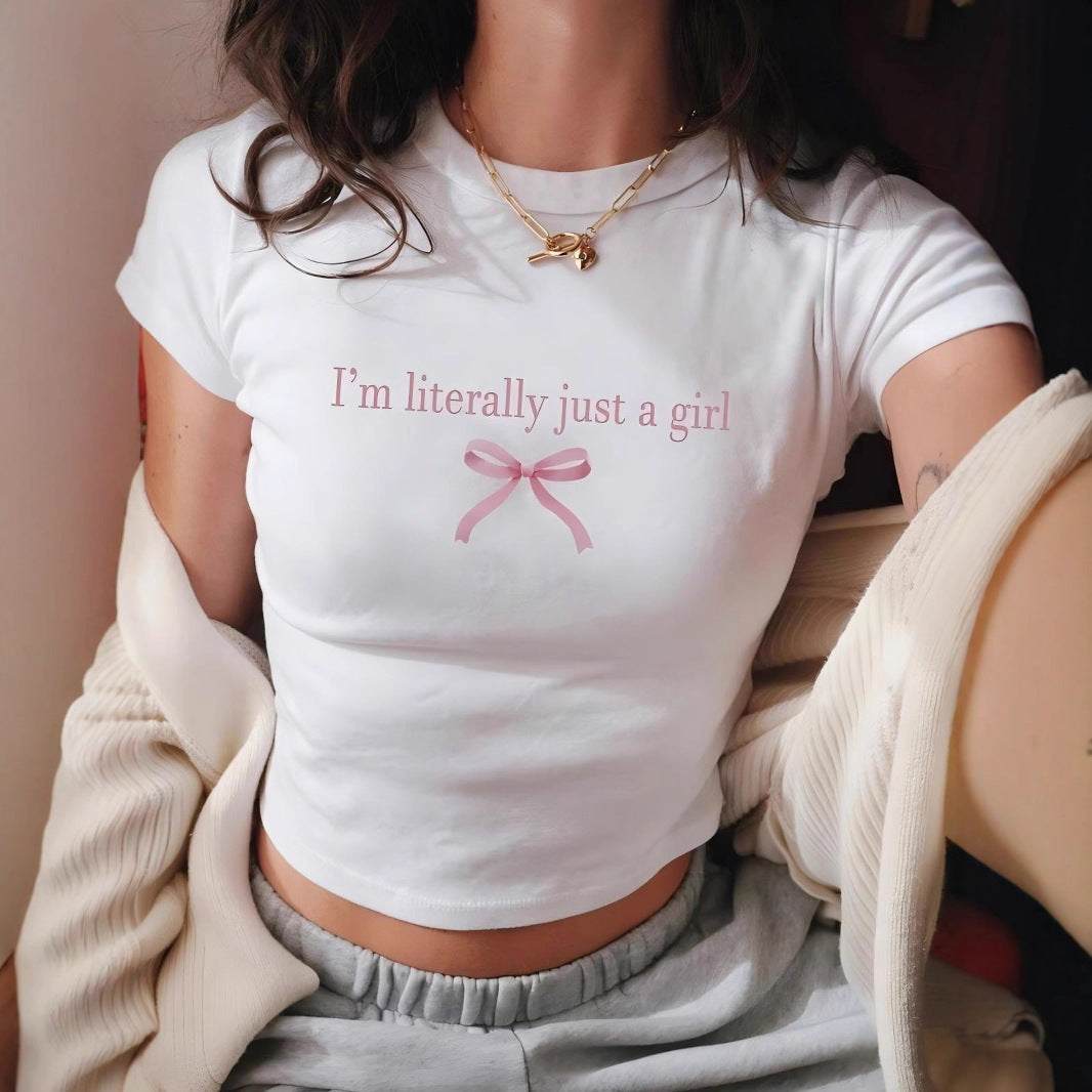 Dam Crop-T-shirt med kreativt tryck och rosett detalj Mirla-Eva Jonsson