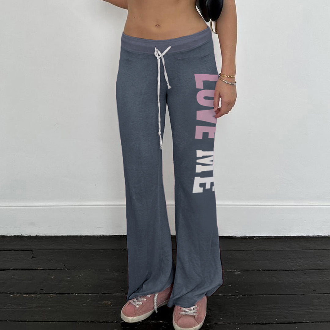 Dam Flared Joggingbyxor med kontrasterande midja och modernt tryck Mirla-Eva Jonsson