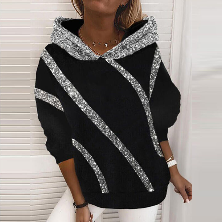 Dam Hoodie med glittersatser och modern skärning Mirla-Eva Jonsson