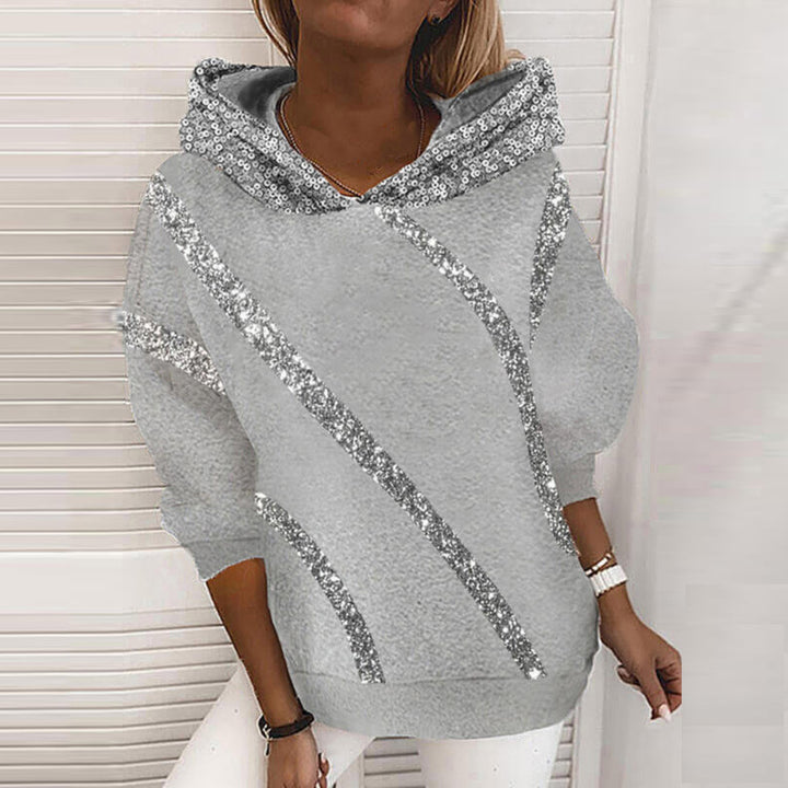 Dam Hoodie med glittersatser och modern skärning Mirla-Eva Jonsson