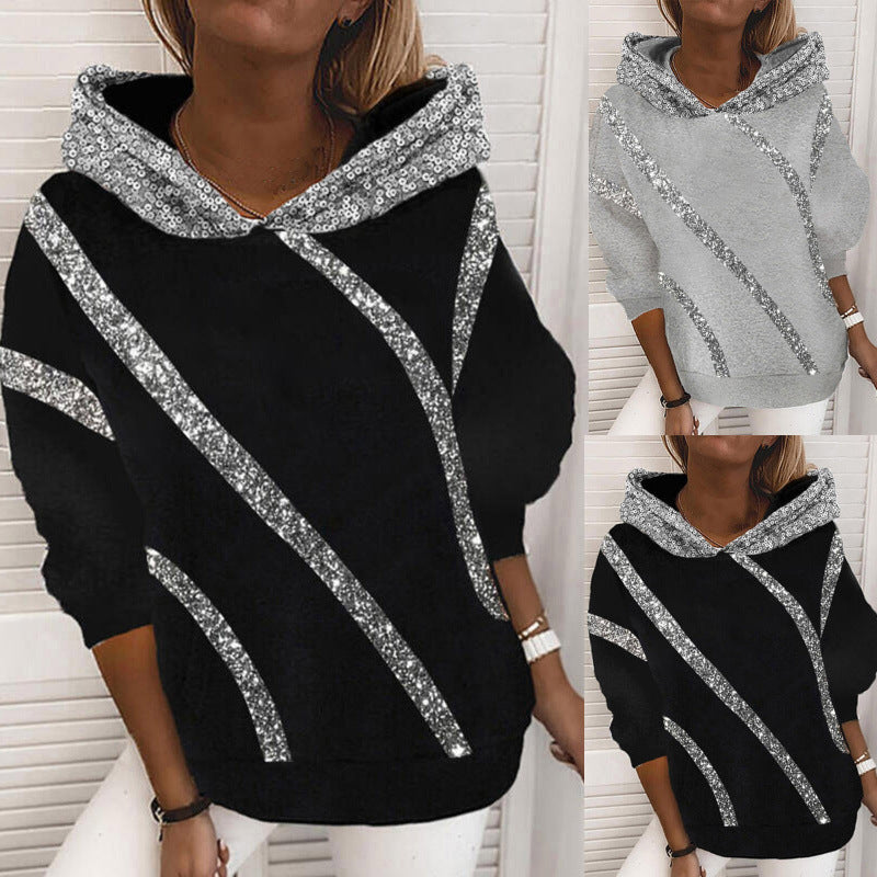 Dam Hoodie med glittersatser och modern skärning Mirla-Eva Jonsson