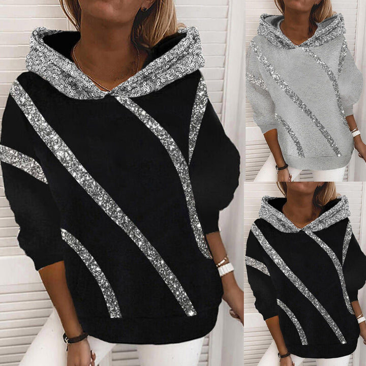 Dam Hoodie med glittersatser och modern skärning Mirla-Eva Jonsson
