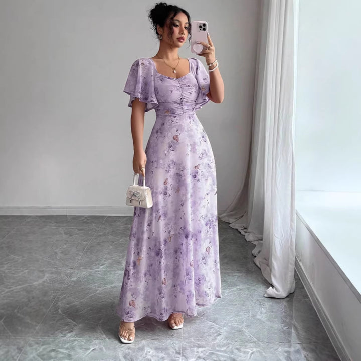 Dam Maxi klänning med flödande snitt och romantisk blommönster Mirla-Eva Jonsson