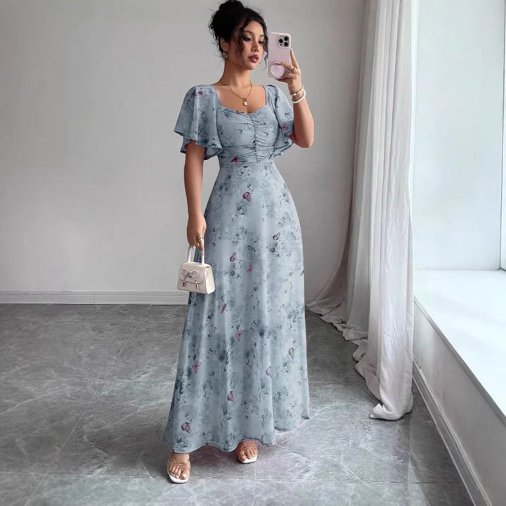 Dam Maxi klänning med flödande snitt och romantisk blommönster Mirla-Eva Jonsson