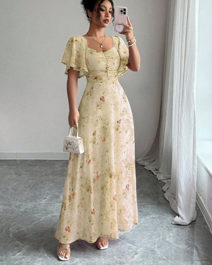 Dam Maxi klänning med flödande snitt och romantisk blommönster Mirla-Eva Jonsson