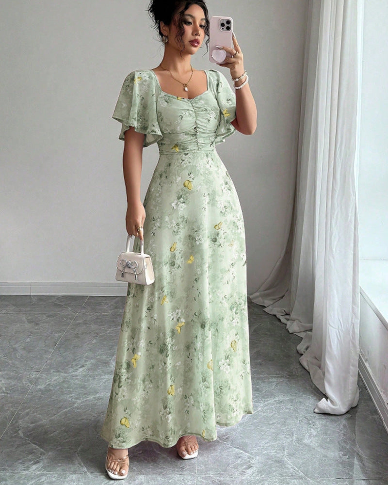 Dam Maxi klänning med flödande snitt och romantisk blommönster Mirla-Eva Jonsson