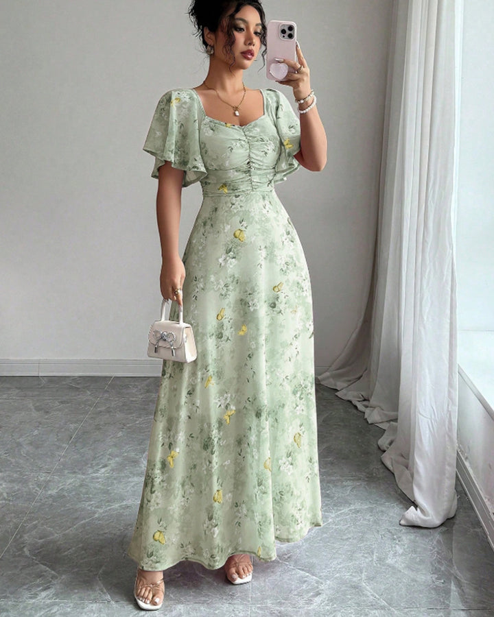 Dam Maxi klänning med flödande snitt och romantisk blommönster Mirla-Eva Jonsson
