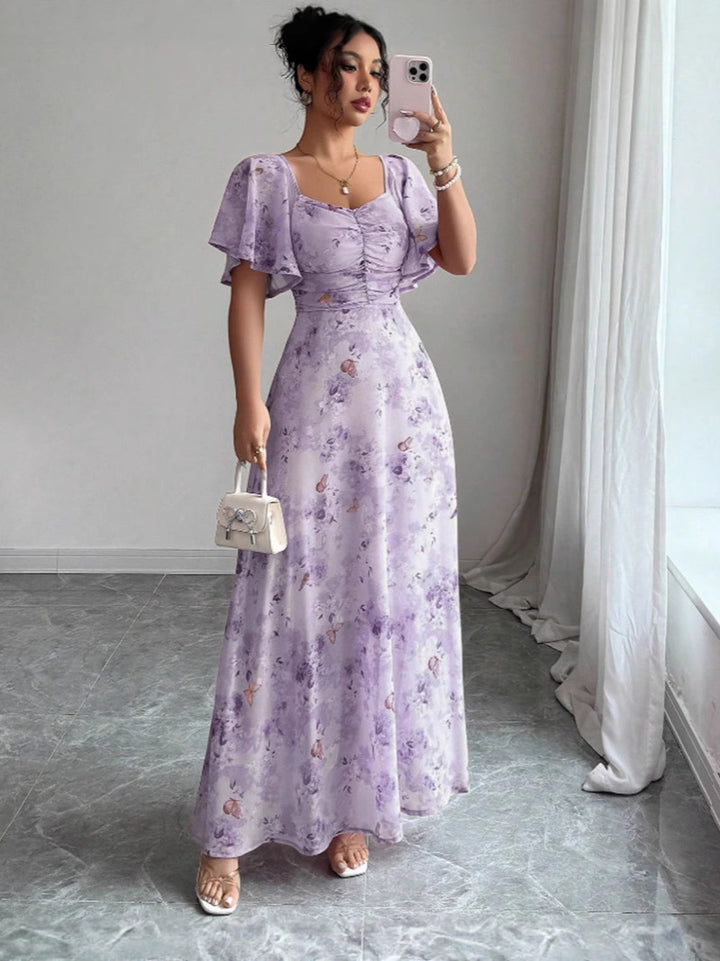 Dam Maxi klänning med flödande snitt och romantisk blommönster Mirla-Eva Jonsson
