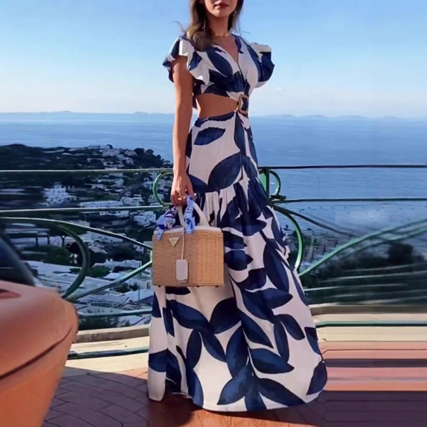 Dam Maxi-klänning med raffinerade cut-out-detaljer och voluminösa volanger Mirla-Eva Jonsson