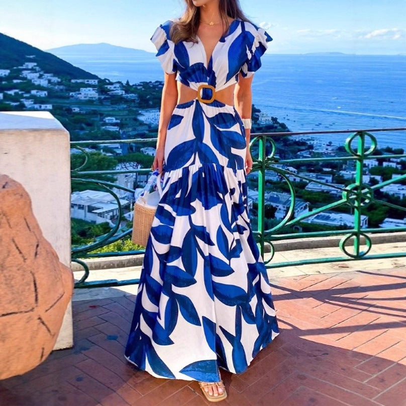 Dam Maxi-klänning med raffinerade cut-out-detaljer och voluminösa volanger Mirla-Eva Jonsson