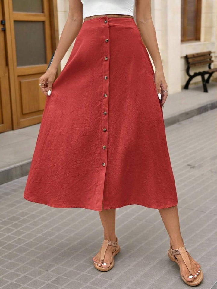 Dam Midi-kjol med elegant knapplist och flödande snitt Mirla-Eva Jonsson