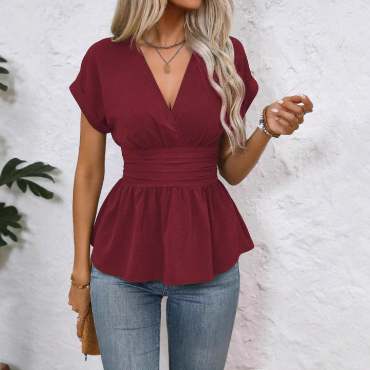 Dam Peplum-blus med V-ringning och midjebälte Mirla-Eva Jonsson