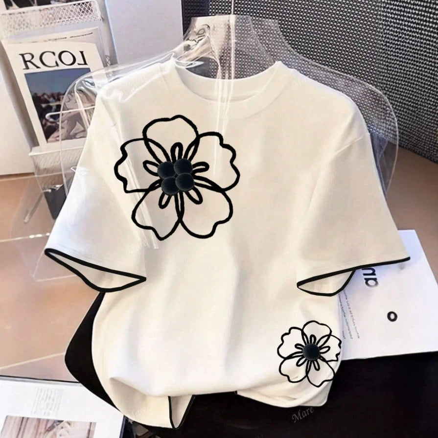 Dam T-shirt med blommigt mönster och lös passform Mirla-Eva Jonsson