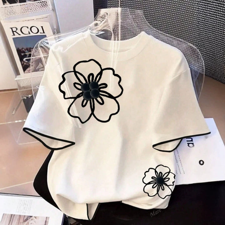 Dam T-shirt med blommigt mönster och lös passform Mirla-Eva Jonsson