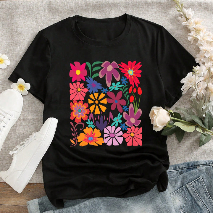 Dam T-shirt med färgg print av blommor Mirla-Eva Jonsson