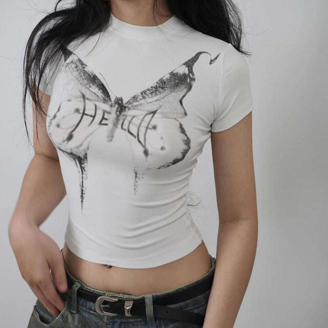 Dam T-shirt med kreativ fjärilstryck och modern skärning Mirla-Eva Jonsson