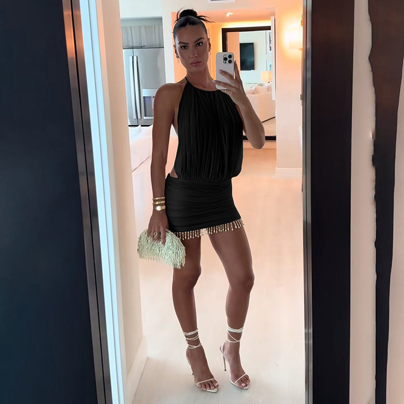 Dam ärmlös miniklänning med rynkor och eleganta detaljer Mirla-Eva Jonsson