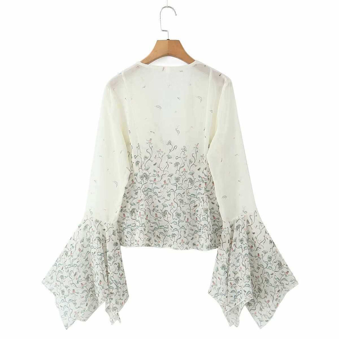 Dam avslappnad blus med eleganta klockärmar och blommönster Mirla-Eva Jonsson