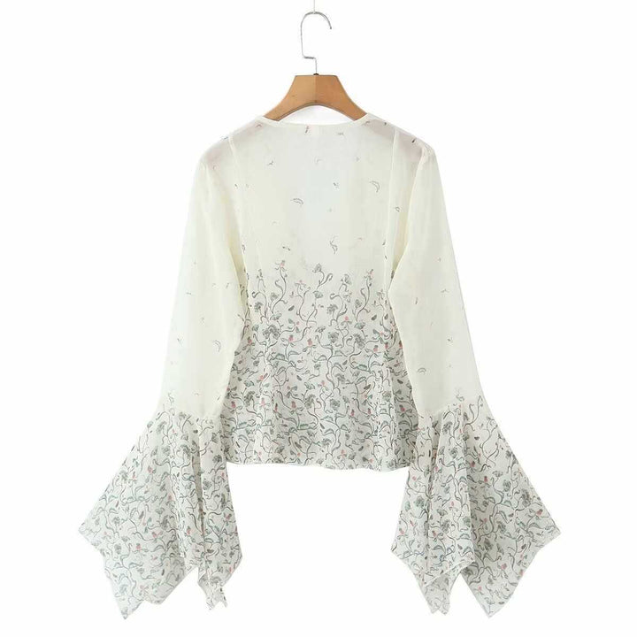 Dam avslappnad blus med eleganta klockärmar och blommönster Mirla-Eva Jonsson
