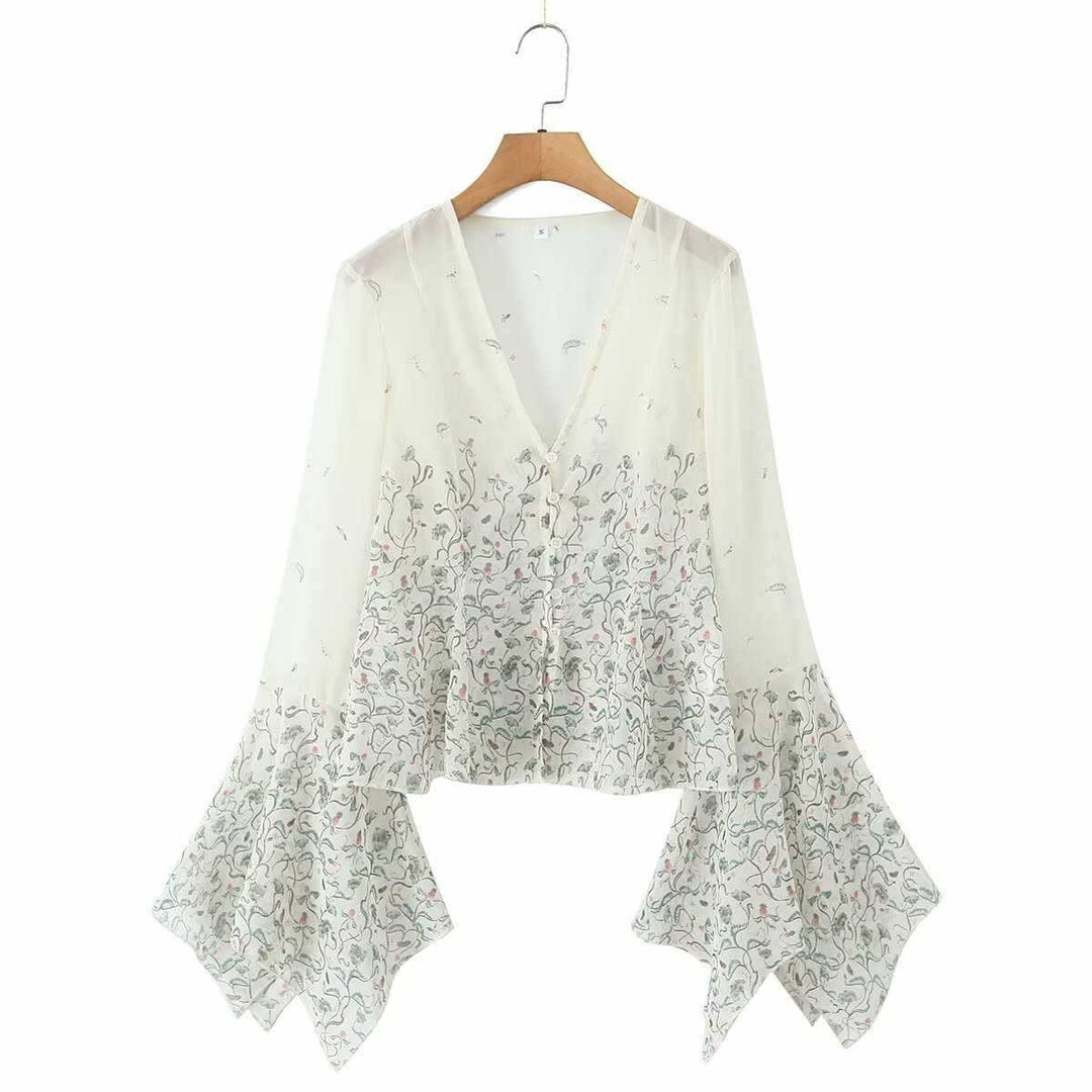 Dam avslappnad blus med eleganta klockärmar och blommönster Mirla-Eva Jonsson