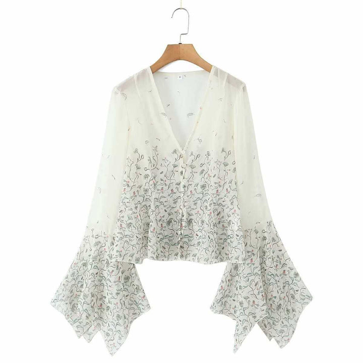 Dam avslappnad blus med eleganta klockärmar och blommönster Mirla-Eva Jonsson