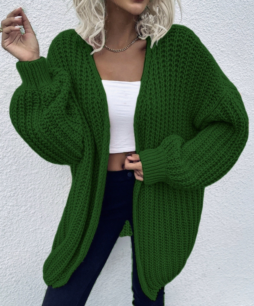 Dam avslappnad grovstickad cardigan med djupa fickor och voluminösa ärmar Eva Jonsson-Eva Jonsson