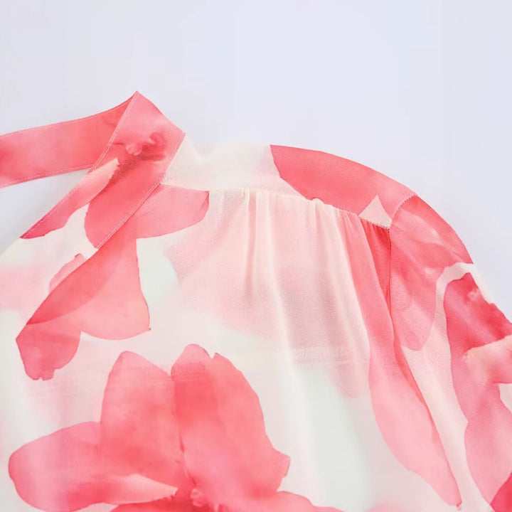 Dam blus med volangdetaljer och blommönster Mirla-Eva Jonsson