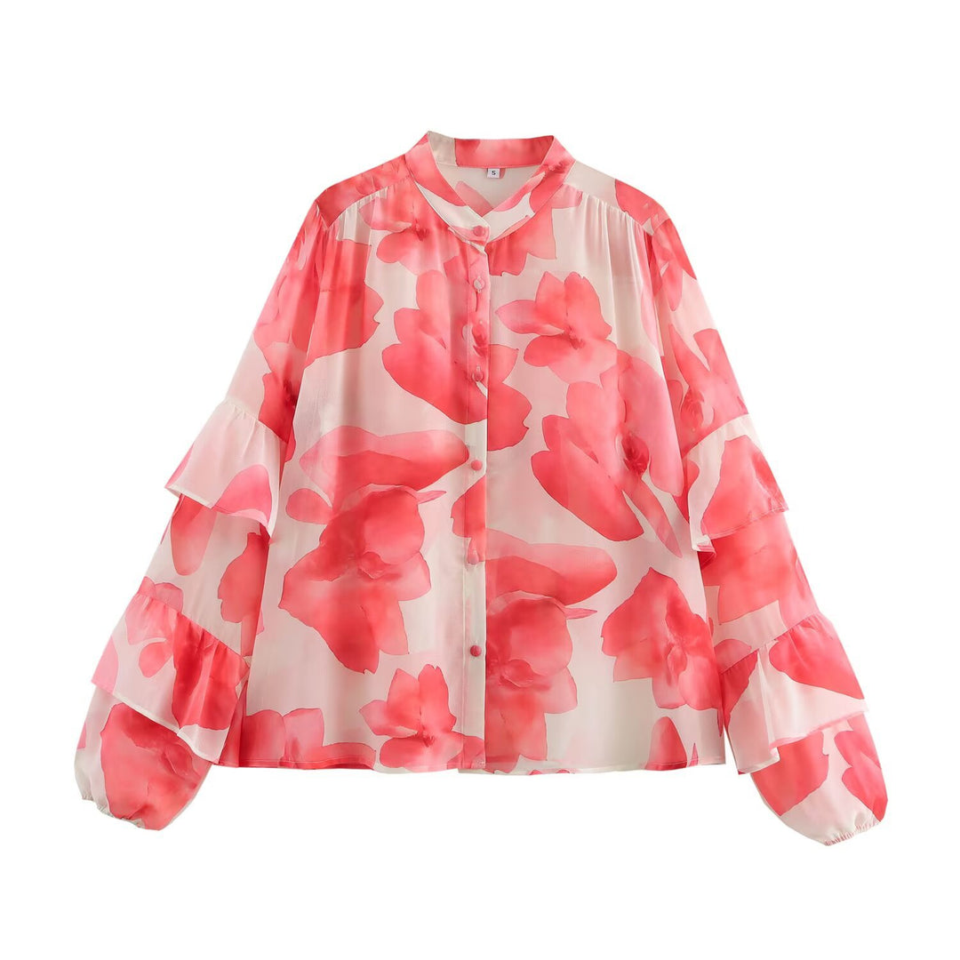 Dam blus med volangdetaljer och blommönster Mirla-Eva Jonsson