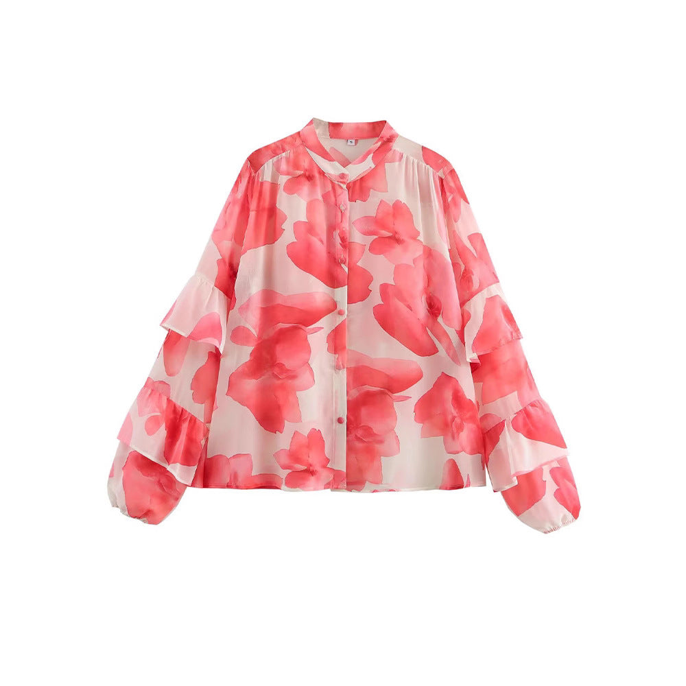 Dam blus med volangdetaljer och blommönster Mirla-Eva Jonsson