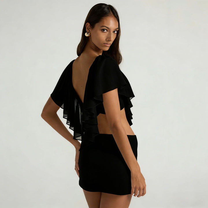 Dam blusenshirt med flytande ruffle-design och djupare uringning Mirla-Eva Jonsson