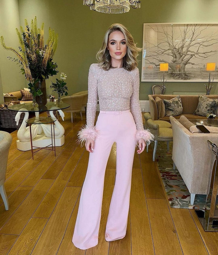 Dam elegant glittrande topp med extravaganta ärmdetaljer Mirla-Eva Jonsson