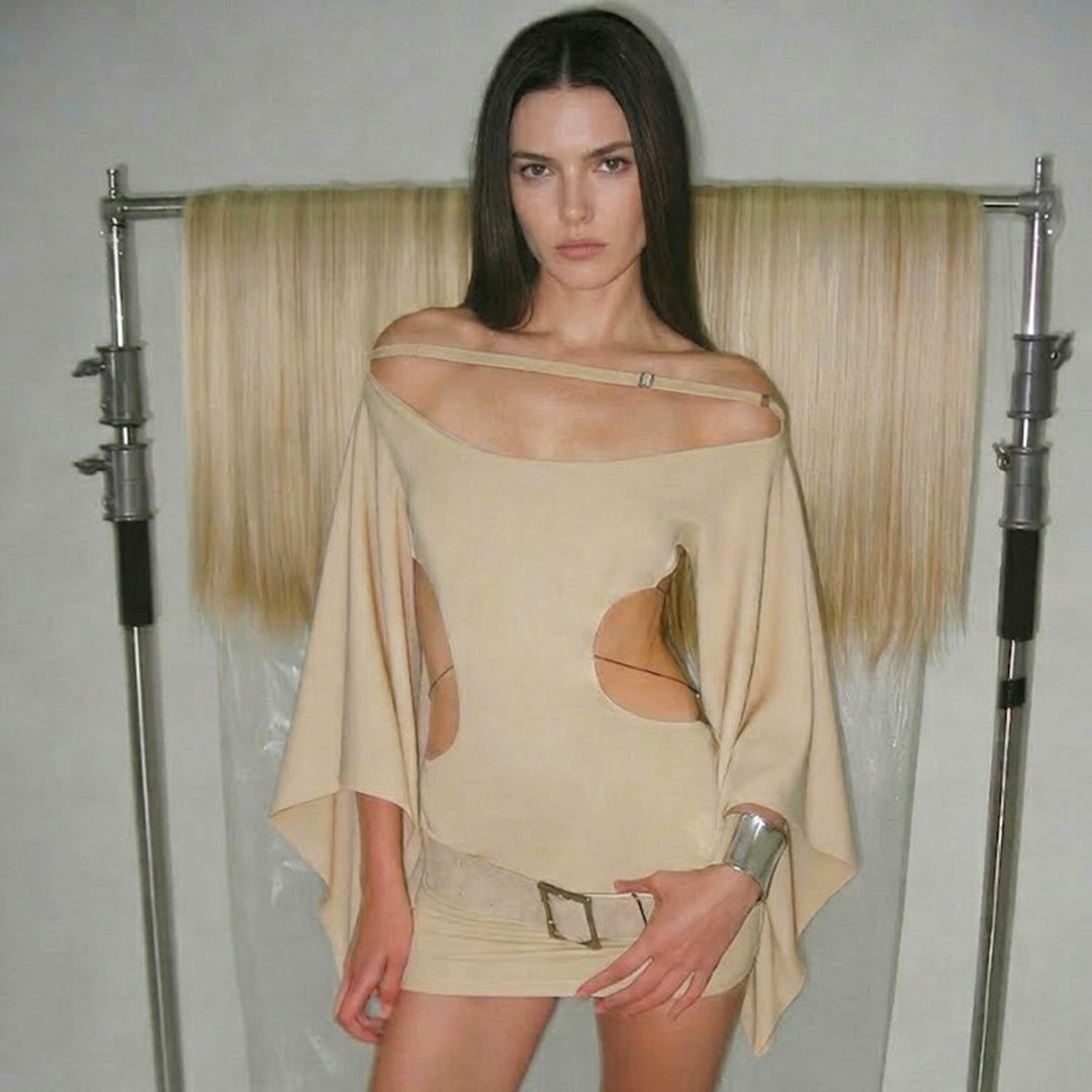Dam elegant oversized klänning med transparenta inskärningar och modern design Mirla-Eva Jonsson