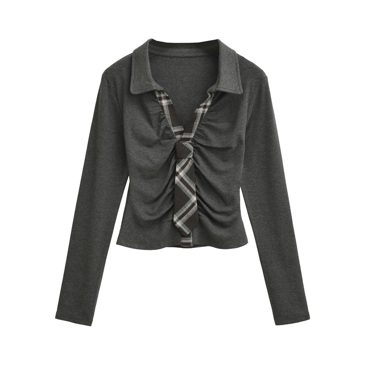 Dam elegant topp med raffinerad drapering och smakfulla rutdetaljer Mirla-Eva Jonsson