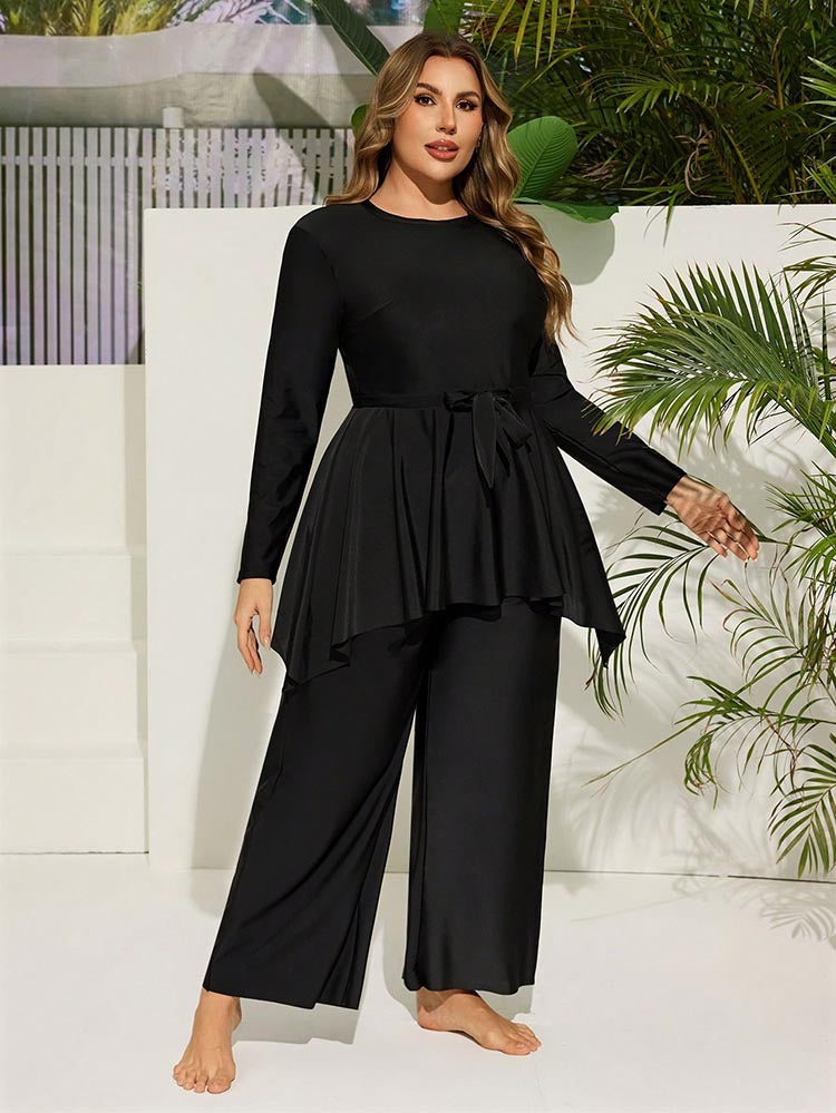 Dam elegant tvådelad jumpsuit med omslagsdesign Mirla-Eva Jonsson