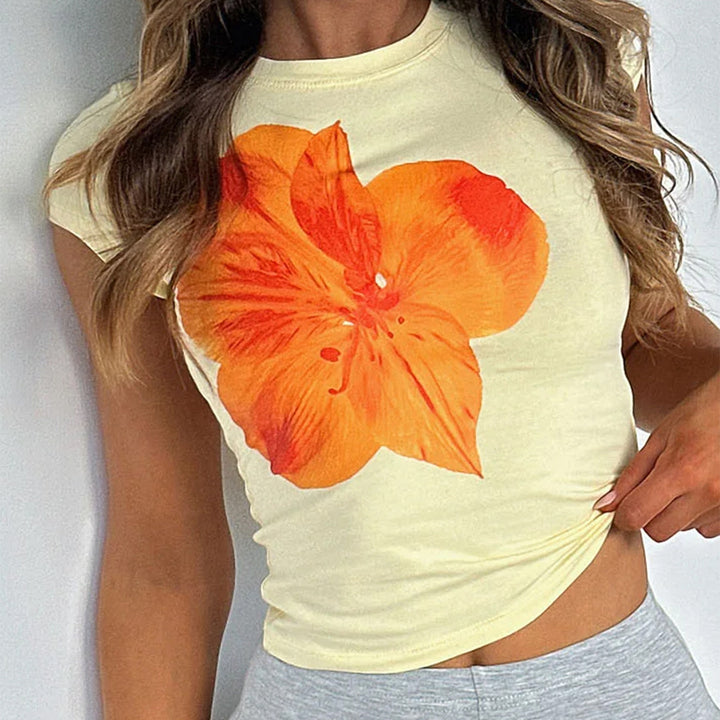 Dam kortärmad t-shirt med blommönster och figurnära passform Mirla-Eva Jonsson