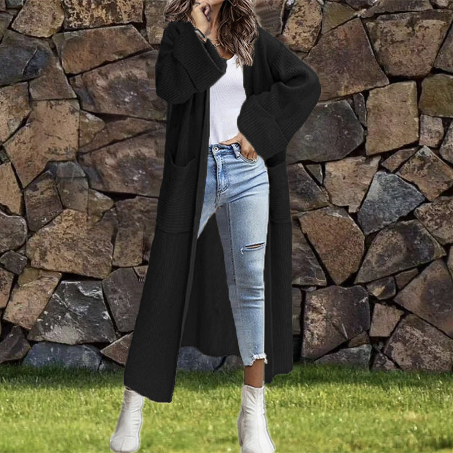Dam långstickad kappa med djupa fickor och elegant design Eva Jonsson-Eva Jonsson