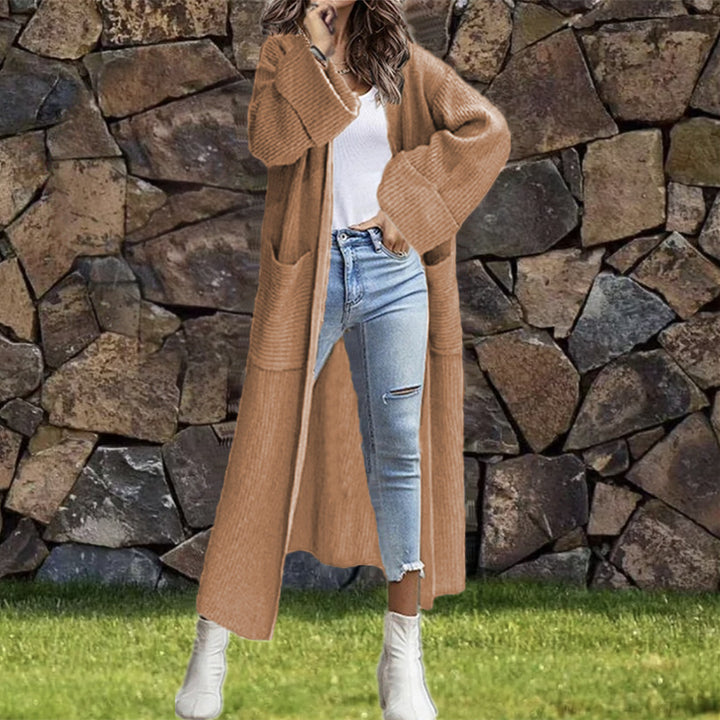 Dam långstickad kappa med djupa fickor och elegant design Eva Jonsson-Eva Jonsson