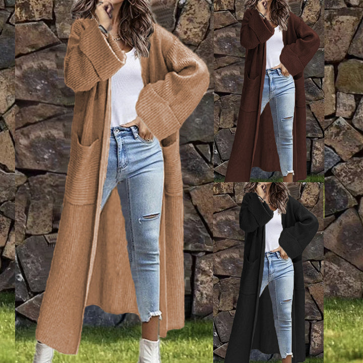 Dam långstickad kappa med djupa fickor och elegant design Eva Jonsson-Eva Jonsson
