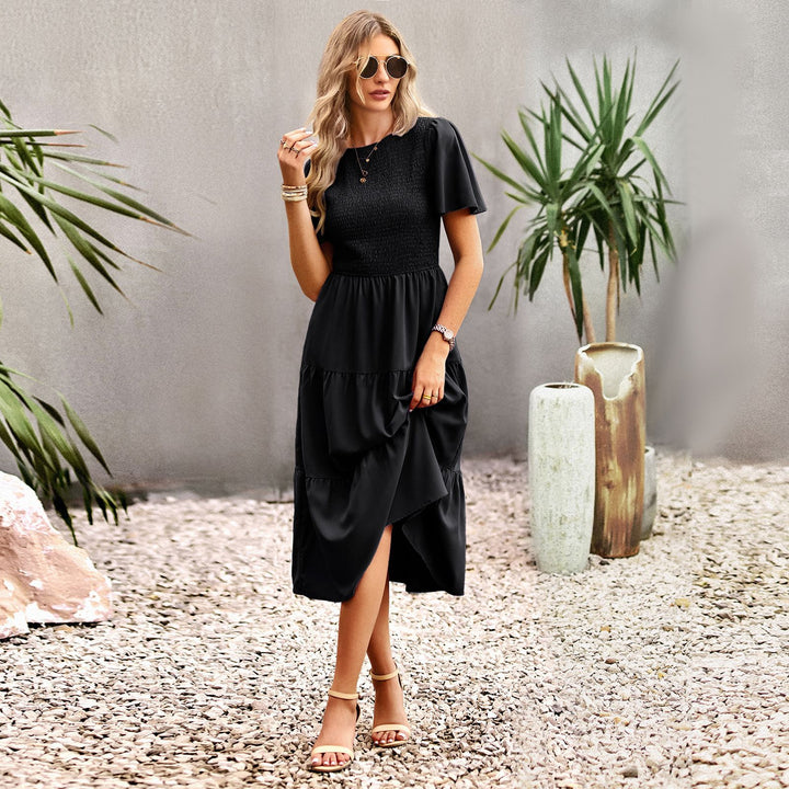 Dam midi dress med svängande volangkant och elastisk överdel Mirla-Eva Jonsson