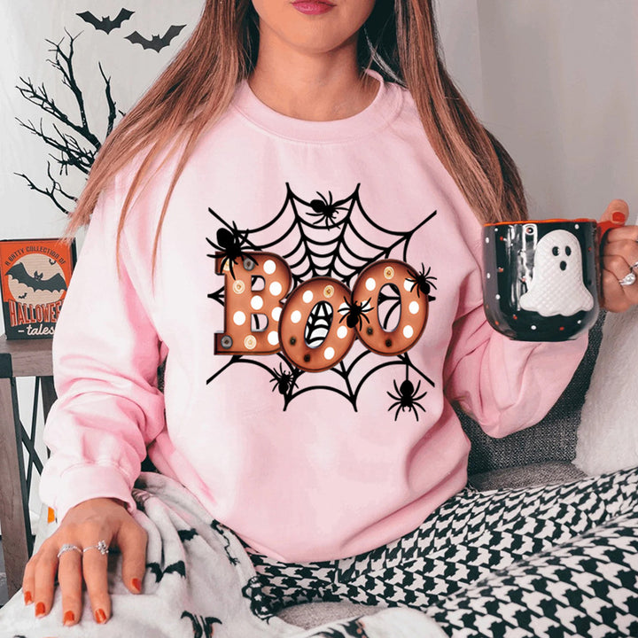 Dam sweatshirt med kreativ Halloween spindelnätsdesign Mirla-Eva Jonsson