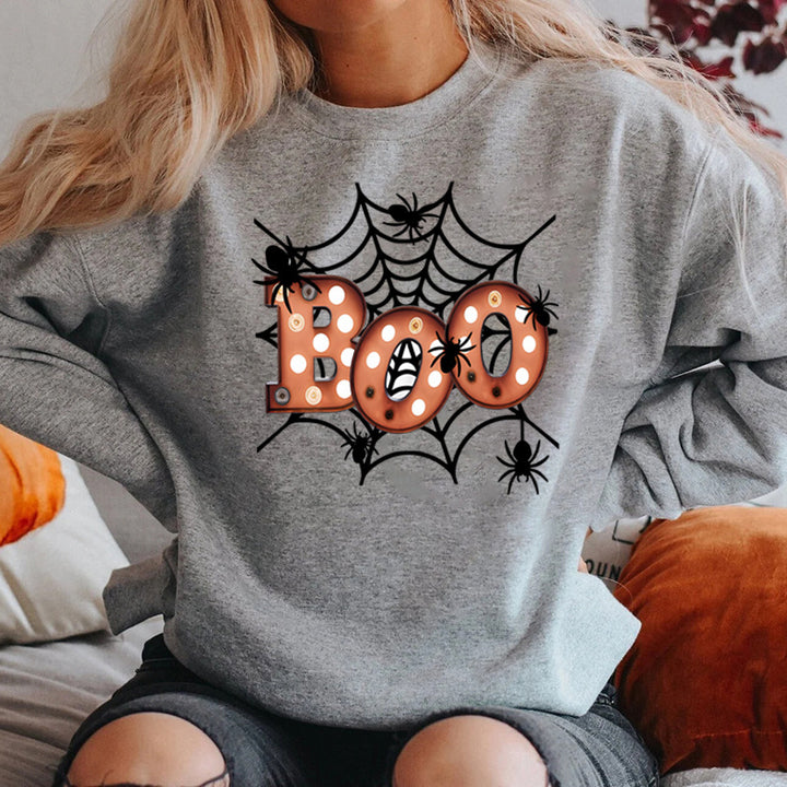 Dam sweatshirt med kreativ Halloween spindelnätsdesign Mirla-Eva Jonsson
