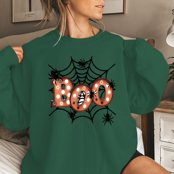 Dam sweatshirt med kreativ Halloween spindelnätsdesign Mirla-Eva Jonsson