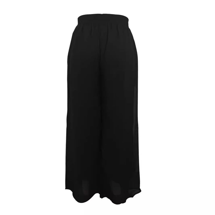 Dam vida skurna chiffontroser med elastisk midja och höga sidofickor Mirla-Eva Jonsson