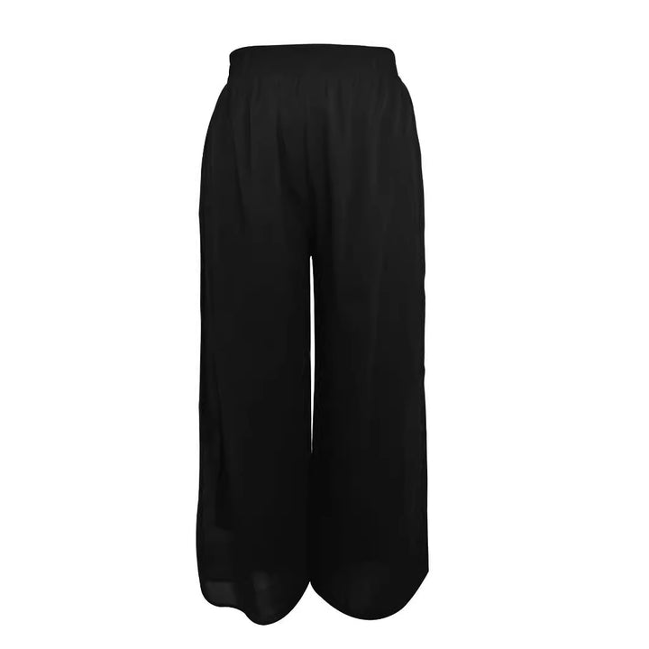 Dam vida skurna chiffontroser med elastisk midja och höga sidofickor Mirla-Eva Jonsson