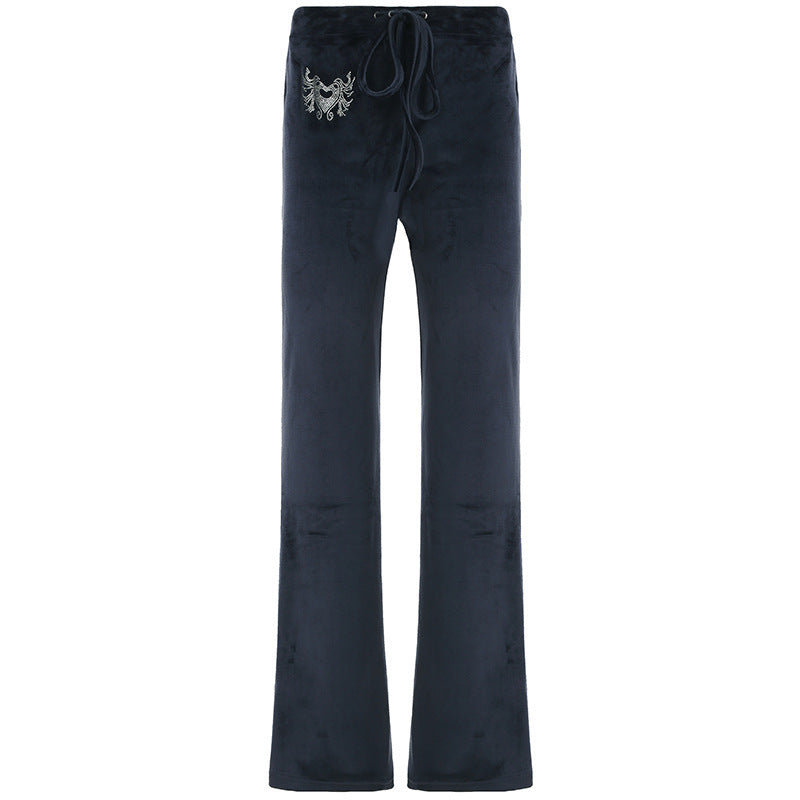 DamSweatpants i avslappnad Flared-design med trendiga broderier Mirla-Eva Jonsson