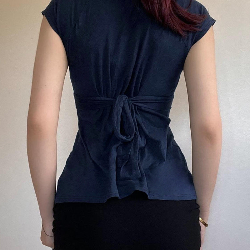 Damask wrap top with decorative tie bands and modern V-neck Mirla-Eva Jonsson