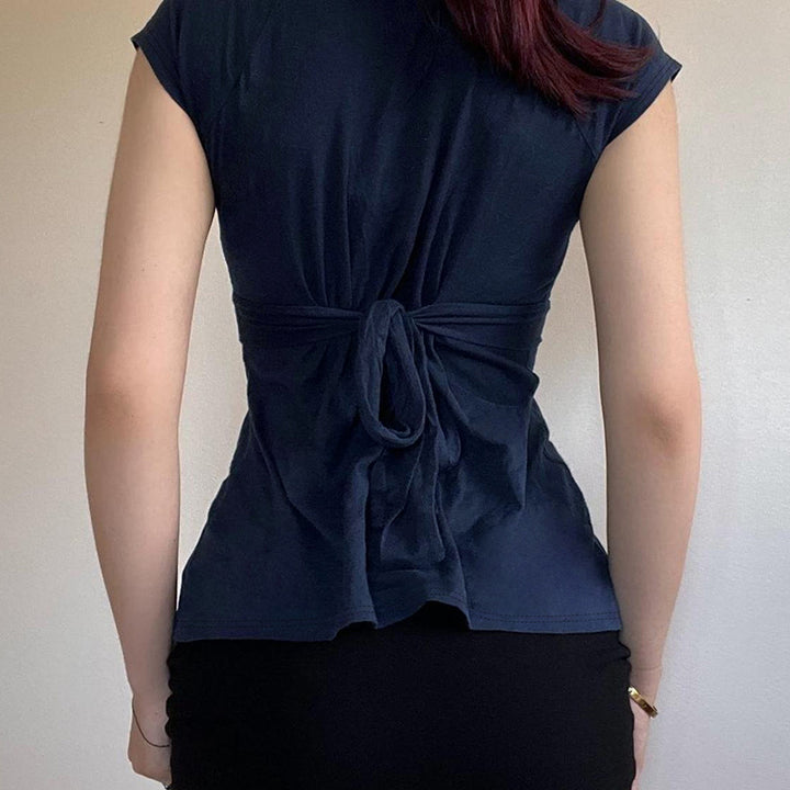 Damask wrap top with decorative tie bands and modern V-neck Mirla-Eva Jonsson
