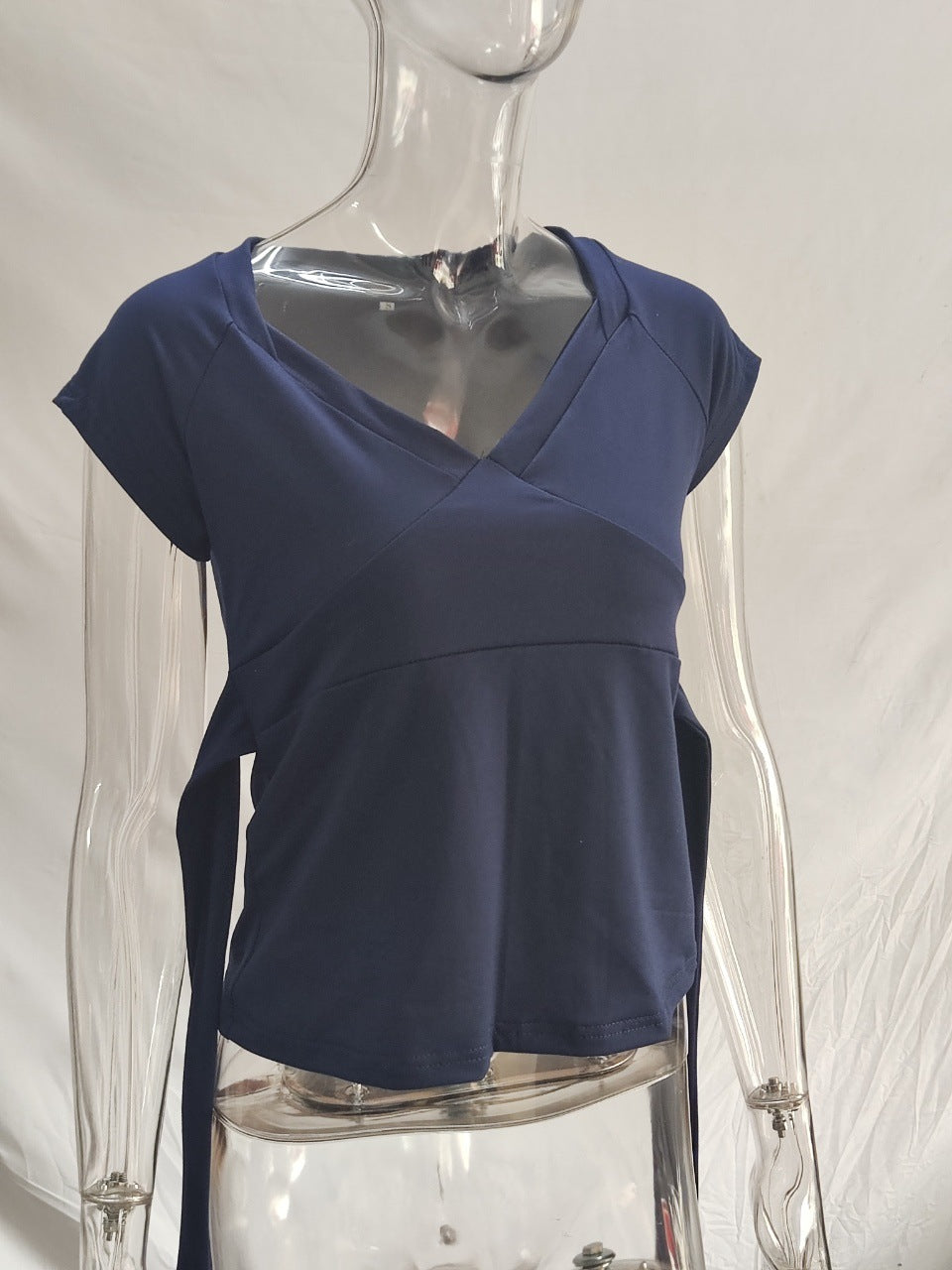 Damask wrap top with decorative tie bands and modern V-neck Mirla-Eva Jonsson